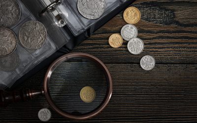 Numismatics. Old collectible coins of silver, gold and copper on the table.  Top view.