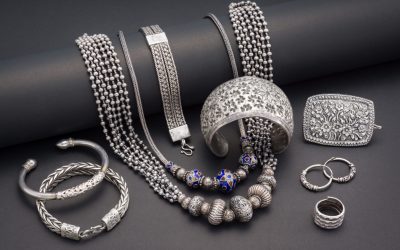 Collection of antique traditional silver jewelry on black paper